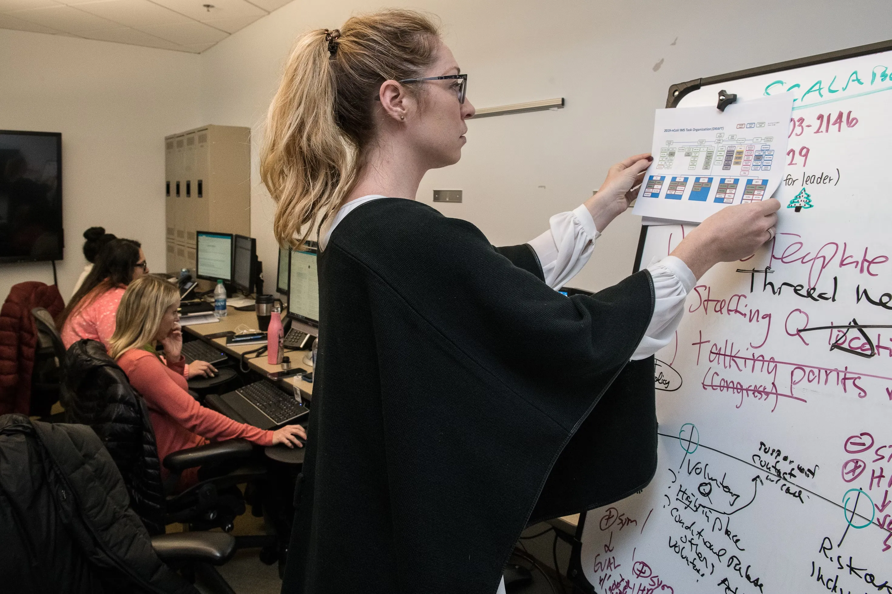 women using the bulletin board