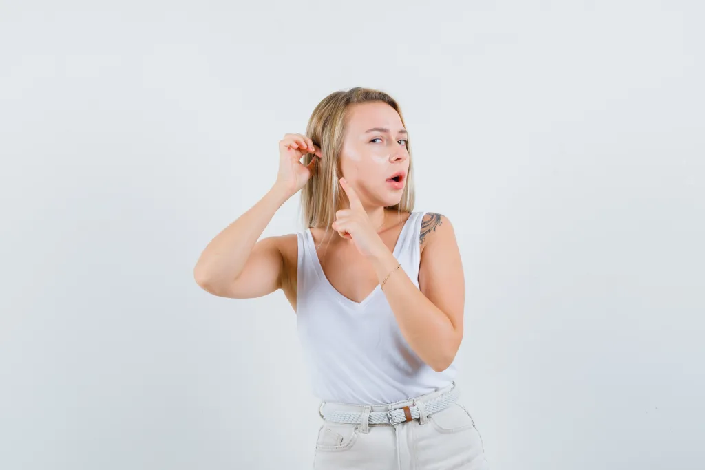 this young lady is thinking how to wear her wireless earbuds correctly