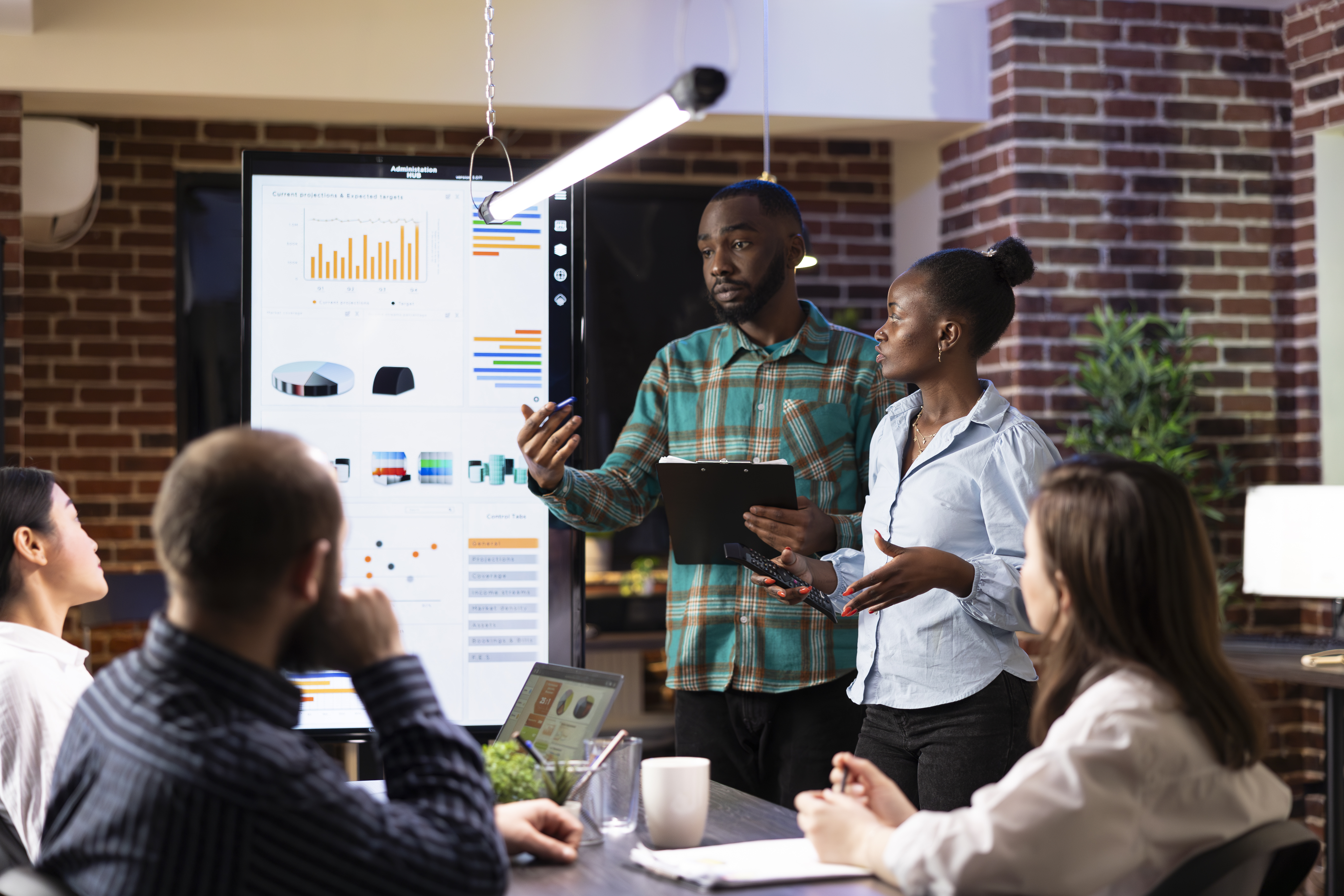 black-employees-explaining-business-analytics.jpg