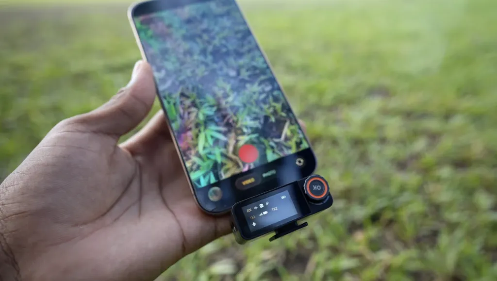 Figure 1: NearStream AWM28T wireless lavalier microphone connected to smartphone for outdoor streaming