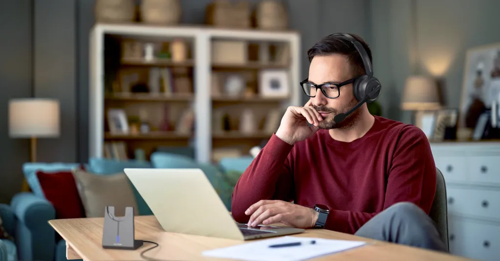 A man wearing headset when working at home 