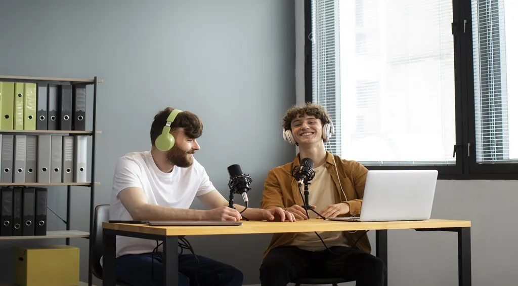 Two people wearing headphones and speaking into microphones during a call