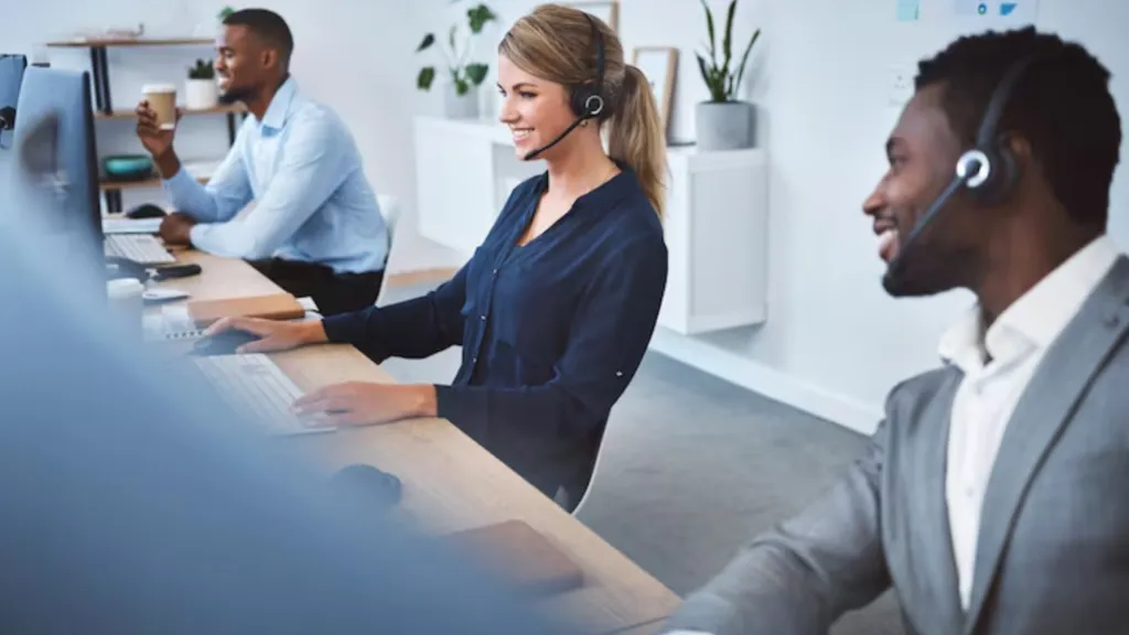 Team of banking call center agents using professional wireless headsets to collaborate and enhance customer experience in financial services.