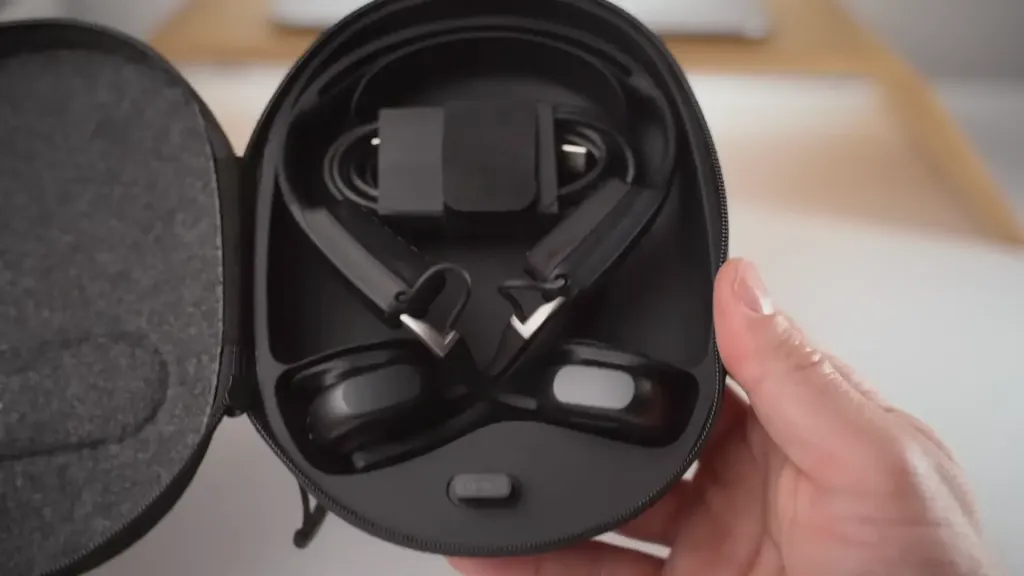 Shokz Open Meet open-ear headset displayed with its high-quality hard carrying case, showing the complete premium package for professional use