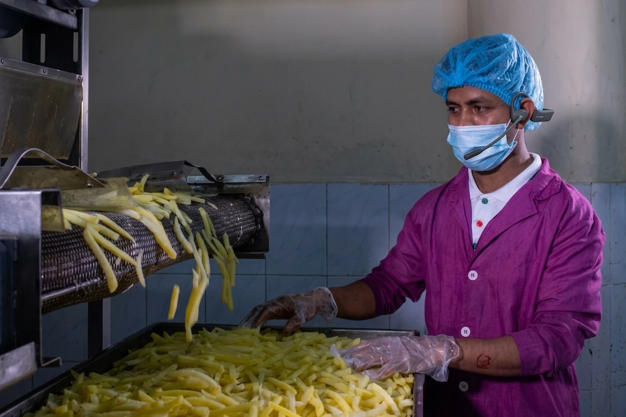 Plant line operator managing a fast-paced production line.
