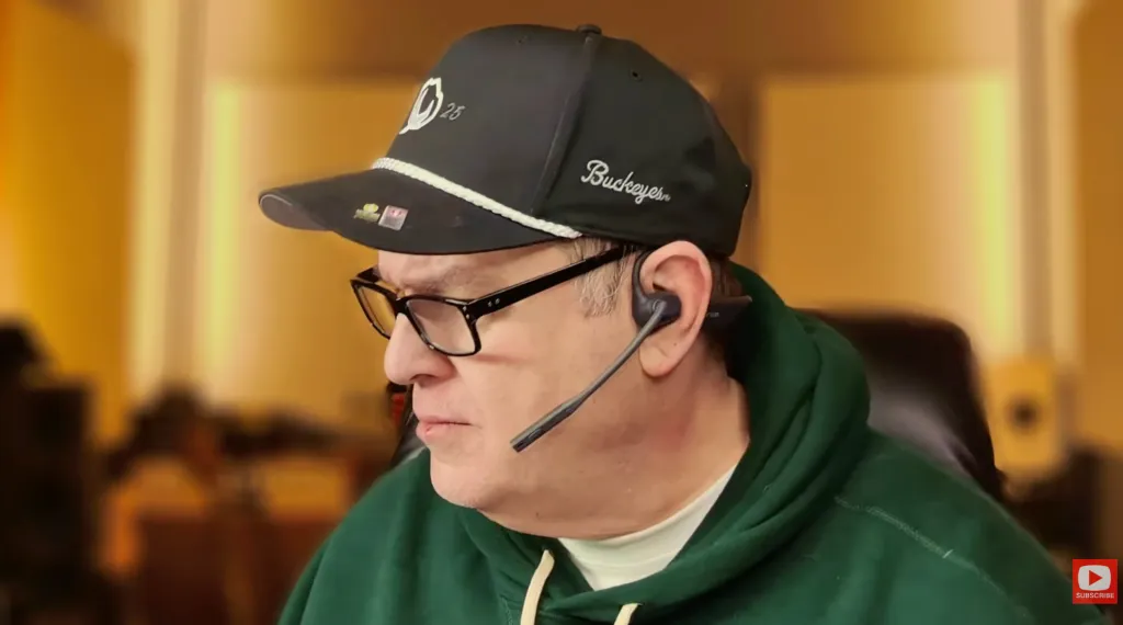 Andrew is demonstrating the boom mic of the OpenEar Pro2.