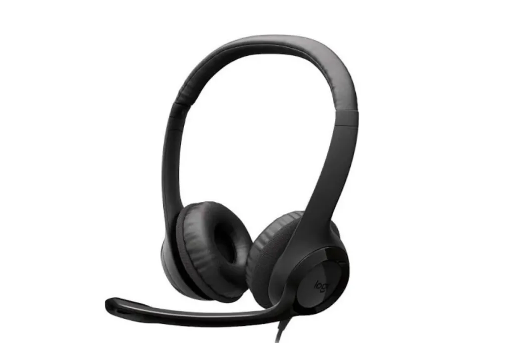 A three-quarter view of a Logitech over-ear headset featuring padded earcups and a long, adjustable microphone boom, on a white background.