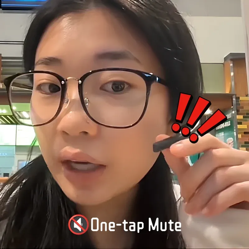A woman demonstrating the one-tap mute button on the Nuroum open-ear headset boom microphone.